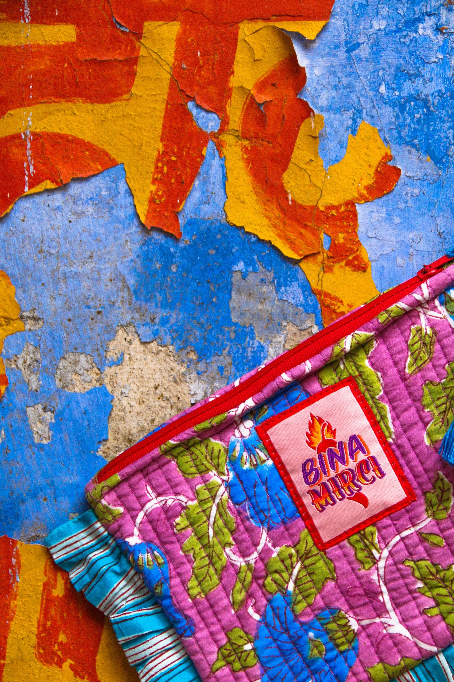 Pochette Kila lilla e turchese